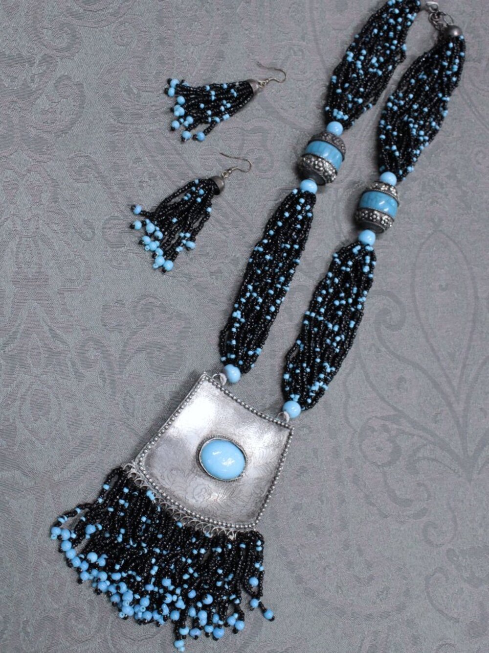 Turquoise and black beaded silver medallion necklace and earrings set